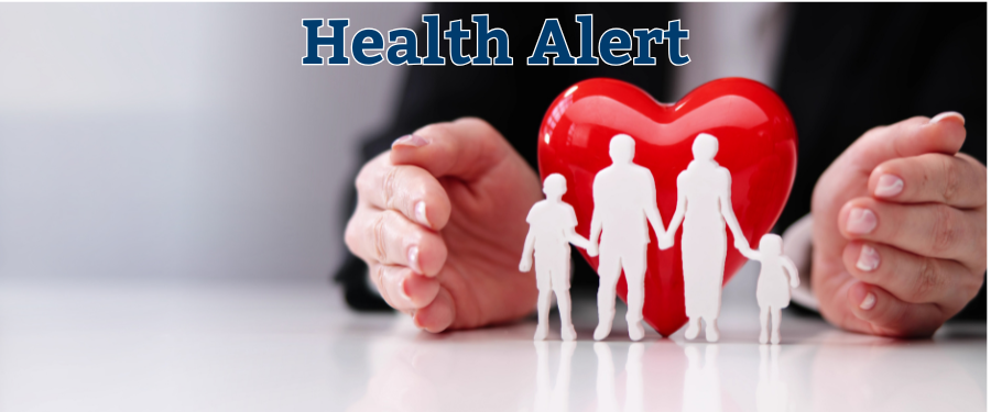 Health Alert Caring hands around plastic red heart with paper cutouts of family in front